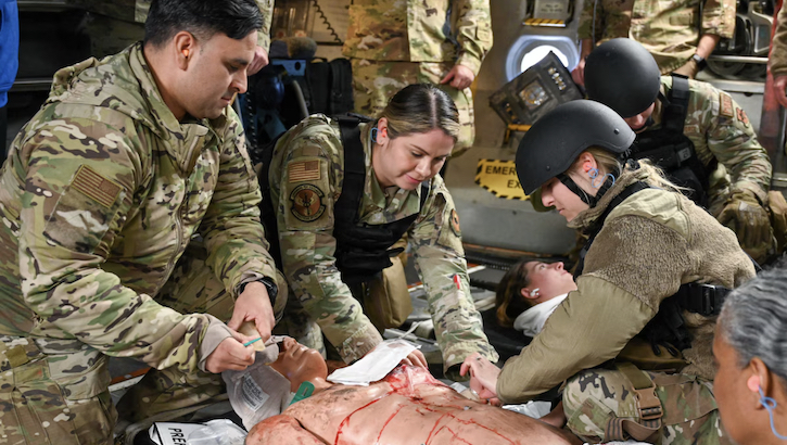 military medical personnel perform tactical combat casualty care