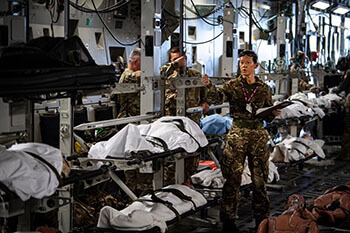 Military personnel giving patients instructions