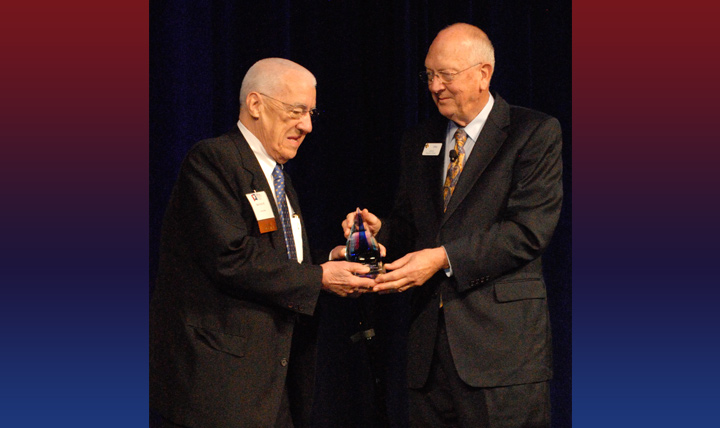 Dr. Basil Pruitt, Jr., left, receives the AMSUS Lifetime Achievement Award from Dr. Michael Cowan, executive director of AMSUS –The Society of Federal Health Professionals, for his more than five decades as one of the leading specialists in the treatment of burns. Pruitt was the director of the U. S. Army Institute of Surgical Research for the last 27 of his 35 years as a military surgeon. As he accepted the award, Pruitt told to audience “If you see a turtle on a fence post, you know he had a lot of help getting there. As the officially designated turtle this morning, I share this award with many others.” In bestowing the honor, Dr. Cowan read a statement from Dr. Jonathan Woodson, Assistant Secretary of Defense for Health Affairs, honoring Dr. Pruitt's contributions to military health. "He has been a leader in his field for over 50 years; he lives at the cutting edge of his surgical specialty and is an internationally renowned burn surgeon; and, he has dedicated his life to public service, and the care to those who have borne the harshest scars of battle. He conducted and led research that dramatically improved the treatment of burns – not just for service members, but for every man, woman and child on the planet." (Courtesy photo)