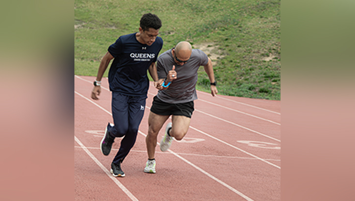 Retired U.S. Army Sgt. 1st Class Henry Escobedo, right, practices sprinting