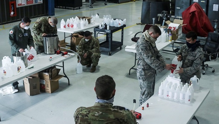 Military personnel packing sanitizing products