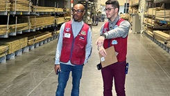 U.S. Air Force Reserve Senior Airman Angel Merced-Morales, 512th Aerospace Medicine Squadron, speaks to Mustafa Kareem Bay, on the left, during his civilian job as a Lowe’s store