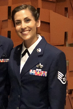 Ms. Arenas smiling, in uniform