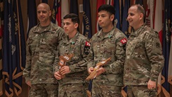 Eighth Army’s Best Medic Competition 2024 winners U.S. Army Staff. Sgt. Daniel Tursi and U.S. Army Staff Sgt. Victor Aguilar stand with U.S. Army Brig. Gen. Roderick Laughman, Eighth Army deputy commanding general - sustainment (far right), and U.S. Army Command Sgt. Maj. Robin Bolmer, Eighth Army senior enlisted advisor (far left), during the closing ceremony at Camp Humphreys, South Korea, Nov. 15, 2024. BMC is a two-soldier team competition that challenges U.S. Army medics in intense, continuous, and realistic operational environments. (U.S. Army photo by Spc. Kelsey Kollar)