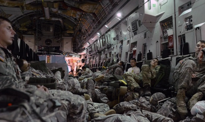 Soldiers, from the 509th Parachute Infantry Regiment, are shown during a 19-hour flight from Alaska to Australia trying to get some sleep on the floor and seats of a Royal Australian Air Force C-17 Globemaster, during Exercise Talisman Sabre 15. Soldiers, who are deployed, average just three hours of sleep a night. (U.S. Army photo by David Vergun)