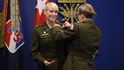 U.S. Army Reserve Maj. Gen. Michelle Link, commanding general, 75th U.S. Army Reserve Innovation Command, presents the Basic Aviator Badge with the Astronaut Device to U.S. Army Maj. Kathleen Rubins, a NASA astronaut, during an awards ceremony at the Pentagon, Arlington, Virginia, Nov. 21, 2024. Rubins underwent intensive instruction on international space station systems, space walks, robotics, physiological training, and flight training at Naval Air Station Whiting Field and NASA in addition to extensive water, land, and winter survival training. (Photo by photo by U.S. Army Sgt. Daniel Hernandez)