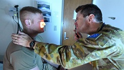 Royal Australian Army Medical Corps Lt. Col. Nathan Smith, a family medicine specialist, examines a patient at the McWethy Troop Medical Clinic on Fort Sam Houston, Texas. Smith has served with the U.S. Army Medical Center of Excellence for two and half years participating in the U.S. Army Medical Department Exchange Program. During his time, he has worked at the Brooke Army Medical Center and the MEDCoE Fielded Force Integration Directorate. The exchange program has been running since the late 1970s. (Courtesy Photo)