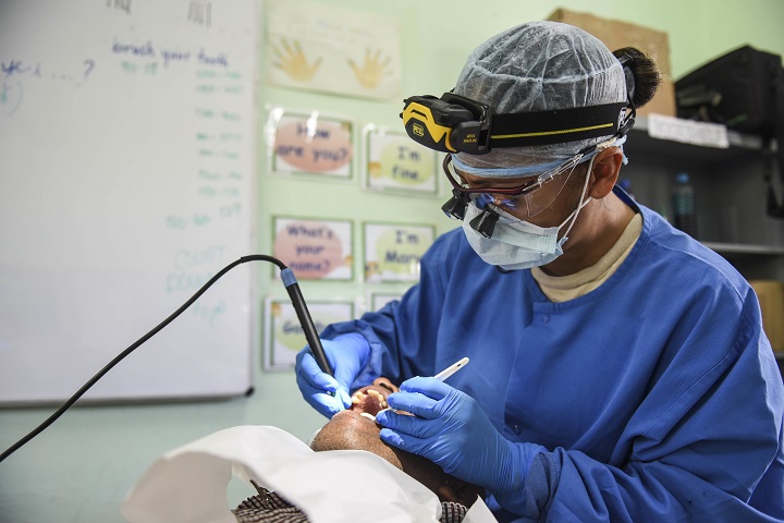 Air Force Master Sgt. Emeriles Curry, 346th Expeditionary Medical Operations Squadron dental hygienist, provides dental care to a local man in the Coclé Province of Panama. To date, in 2-weeks’ worth of Medical Readiness Training Exercises, the teams working in conjunction with the Panamanian Ministry of Health, have seen nearly 4,700 patients. The medical team is participating in Exercise New Horizons 2018, which is a joint training exercise focused on medical, civil engineer and support service personnel’s ability to prepare, deploy, operate, and redeploy outside the United States. (U.S. Air Force photo by Senior Airman Dustin Mullen)