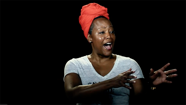 Image of Dr. Zoe Spencer, the guest speaker for the Defense Health Agency’s Black History Month event Feb. 15, in her Emmy-winning spoken word piece “Say Her Name.”  (Credit: "Say Her Name - Zoe Spencer - School of Thought" on YouTube).