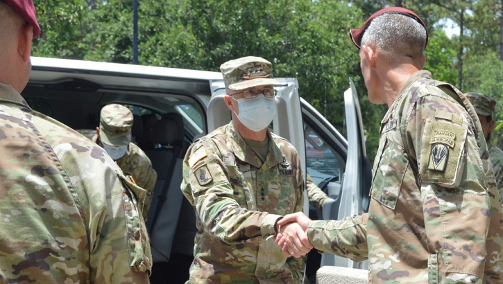Image of Two generals shake hands. Click to open a larger version of the image.