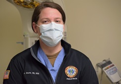 Military health personnel wearing a face mask posing for a picture