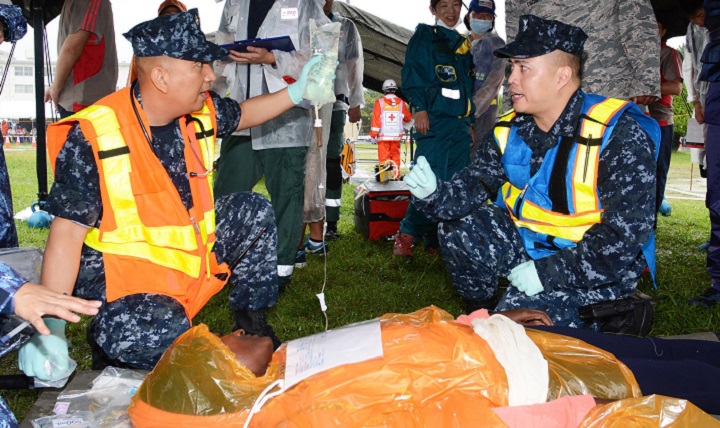 Link to Photo: Navy Lt. Cmdr. Reginaldo Cagampan, left, and Navy Hospital Corpsman 1st Class Rocky Pambid, members of the U.S. Naval Hospital Yokosuka Emergency Response Team, treat a simulated patient during the 2016 Big Rescue Kanagawa Disaster Prevention Joint Drill in Yokosuka city, Japan. Multiple agencies took part in the drill including the U.S. Navy, Army and Air Force, as well as personnel from the Japan Self-Defense Force and Japanese government agencies. (U.S. Navy photo by Greg Mitchell)