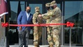 Military personnel cutting a ribbon at the new blood donor center