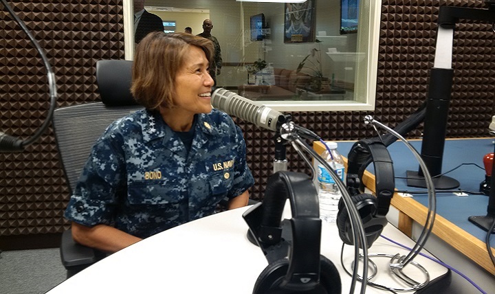 Navy Vice Adm. Raquel C. Bono, Defense Health Agency director, conducts a radio interview with the American Forces Network, Okinawa on her visit to the TRICARE pacific commanders and Stakeholders forum.