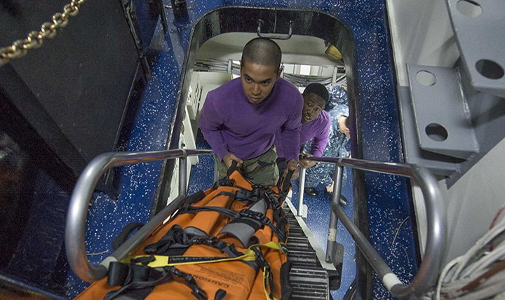 U.S. sailors participate in a medical evacuation exercise aboard the amphibious assault ship USS Boxer (U.S. Navy photo by Mass Communication Specialist 3rd Class Conor Minto)