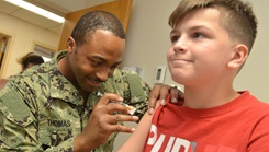 A boy gets the COVID-19 vaccine