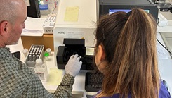 William Gruner, a molecular biologist with the U.S. Air Force School of Aerospace Medicine 711 Human Performance Wing, and Pilar Mandujano, a laboratory technician with Landstuhl Regional Medical Center, prepare the Illumina MiSeq for genomic characterization of influenza virus samples.