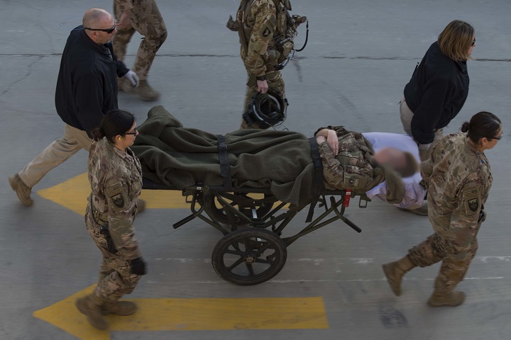 A medical team transports a patient by a stretcher to Craig Joint Theater Hospital at Bagram Airfield, Afghanistan, Dec. 10, 2018. Before entering the hospital, patients are thoroughly assessed, administratively in-processed and checked for any explosive ordnance or weapons. (U.S. Air Force photo by Senior Airman Kaylee Dubois)