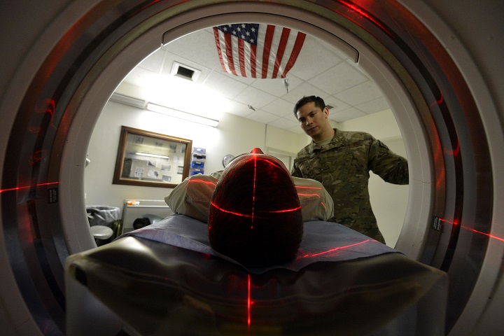 An Army medic positions a patient for a CT scan, which helps radiologists diagnose different types of disease and injuries. Medical devices, such as radiology imaging systems, must now go through a cybersecurity validation process in order to connect to military networks (U.S. Army photo by Staff Sgt. Evelyn Chavez)