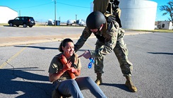 U.S. Air Force Tech. Sgt. Robert Thorne, 71st Medical Group diagnostic and therapeutics flight chief, assists a patient during the Caduceus Spear exercise at Clinton Sherman Airfield Park, Oklahoma, on Oct. 26, 2023. The real life patients were actors from the 97th Medical Group who were tasked with giving realistic responses to the airmen assisting them. (Photo by U.S. Air Force Airman 1st Class Kari Degraffenreed)