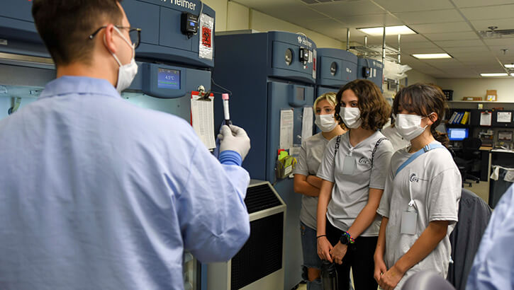 Image of Military personnel demonstrating lab testing procedures.