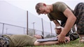 Military medical personnel practice lifesaving procedures