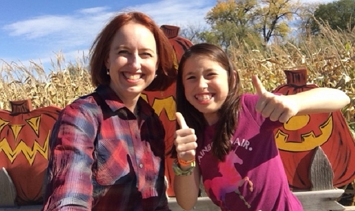 Air Force Col. Theresa Medina, 319th Medical Group commander, and her daughter Sophia, pose for a photo at a harvest festival Oct. 7, 2017 at Grand Forks, N.D. Medina was diagnosed with stage one breast cancer on Nov. 3, 2011, but with the help of TRICARE and the support of family and friends she is now cancer free. (Courtesy photo)