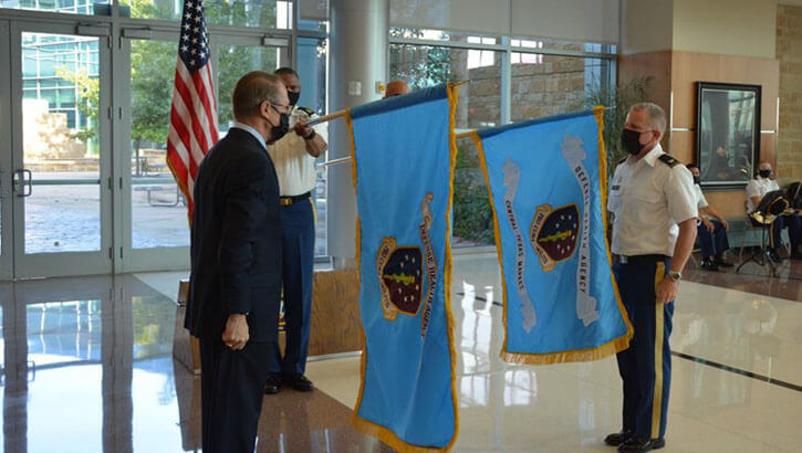Image of Unfurling of the flags during the ceremony of the Central Texas Market.