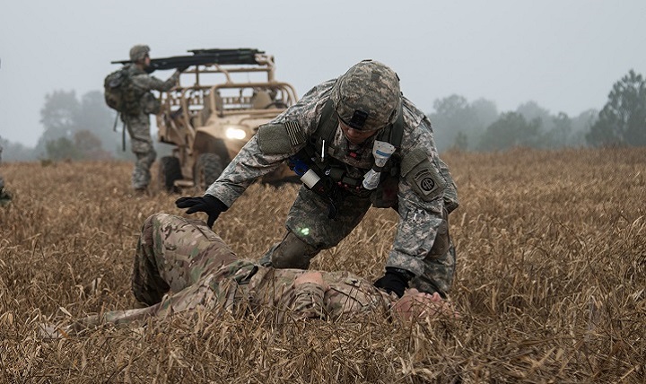 A medical Paratrooper assigned to the 2nd Brigade Combat Team, 82nd Airborne Division, prepares to assess a simulated casualty during Combined Joint Operational Access Exercise, 16-01. 