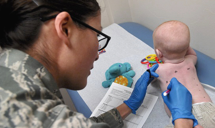 Air Force Senior Airman Catherine Settles, 633rd Medical Group aerospace medical technician, numbers a baby’s back to record which allergen will be applied for a skin prick test at U.S. Air Force Hospital Langley, Virginia. The allergy clinic also conducts skin patch and oral challenge tests to identify a patient’s allergies. (U.S. Air Force photo by Airman 1st Class Austin Harvill)