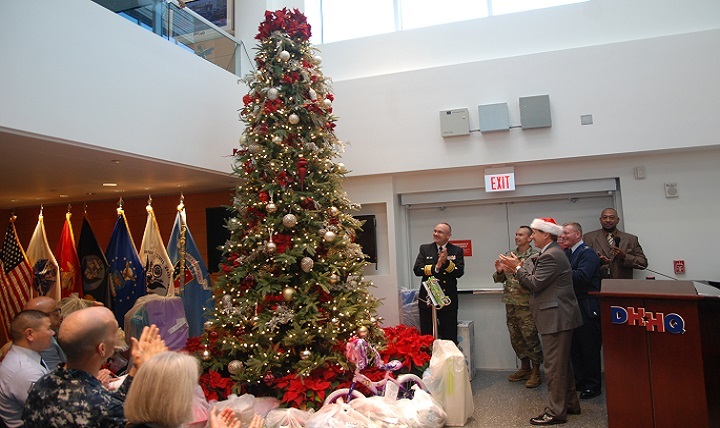 David Bowen (center, in the Santa hat), director of the Defense Health Agency’s Health IT Directorate, lights the Christmas tree at the agency’s headquarters at Falls Church, Virginia, on Dec. 10, 2015. 