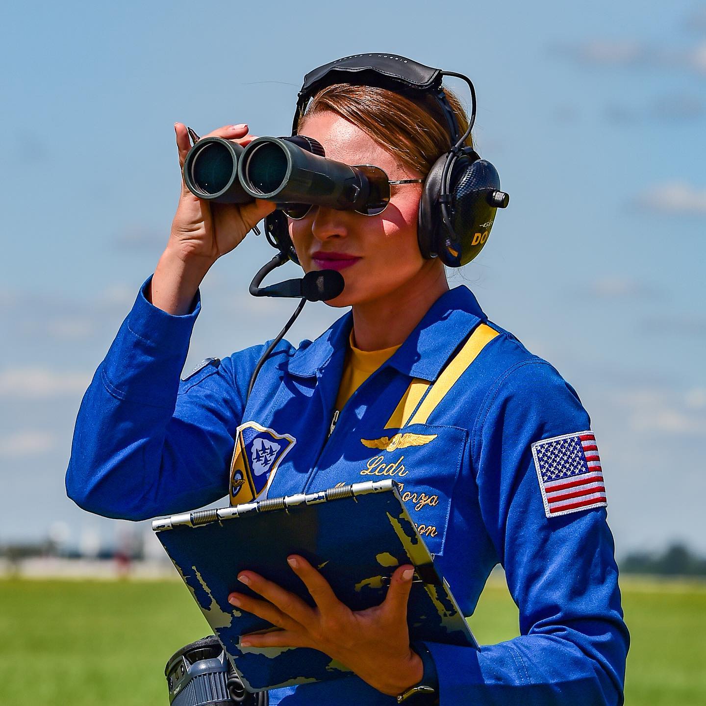 U.S. Navy Lt. Cmdr. (Dr.) Monica Borza looks through binoculars