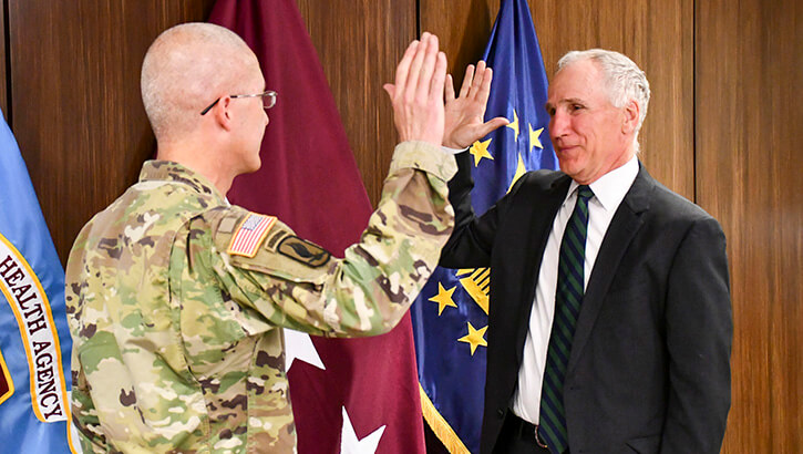 Image of Defense Health Agency (DHA) Director Lt. Gen. (Dr.) Ron Place, left, swears in Dr. Michael Malanoski as new DHA Deputy Director, in Falls Church, Virginia, May 9, 2022. Click to open a larger version of the image.