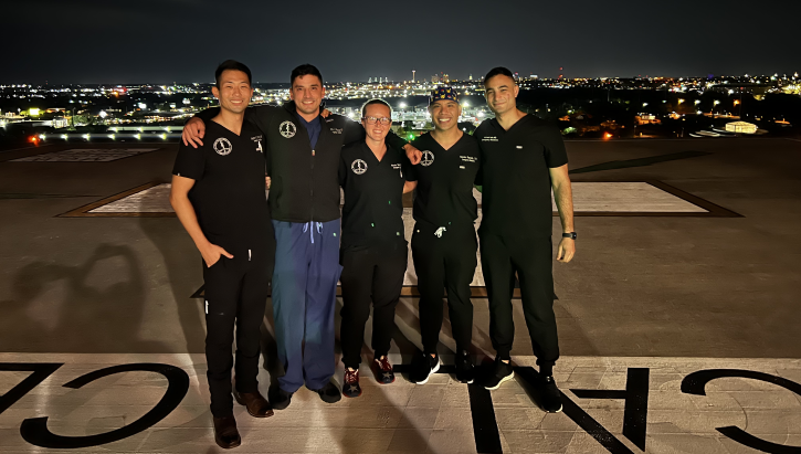 Emergency medicine resident physicians on helipad of Level I trauma center.