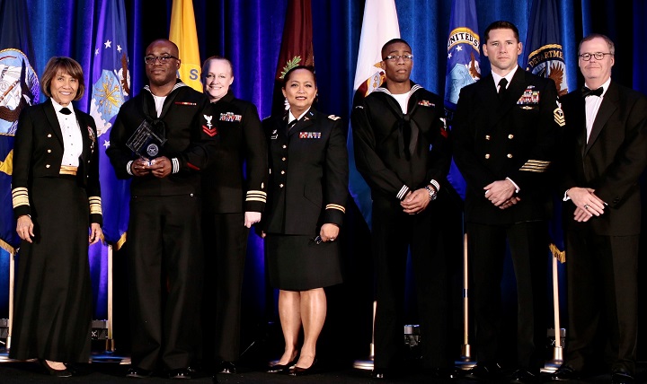 Navy Vice Adm. Raquel Bono, director, Defense Health Agency (far left) and Thomas McCaffery, acting Assistant Secretary of Defense for Health Affairs (far right), present the MHS “Advancements towards High Reliability in Health Care” Quality and Patient Safety Award to Fort Belvoir Community Hospital for “Improving Sterile Instrument and Process Handling.” Accepting award (left to right) are Navy Petty Officer 2nd Class Daniel Asante, Navy Lt. Cmdr. Lara Kirchner, Army Maj. Shirley Ochoa-Dobies, Navy Petty Officer 2nd Class Daniel Renardo Reid and Chief Petty Officer James Pell. (Courtesy photo)