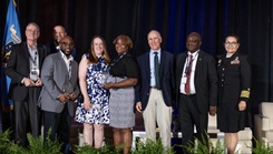 Defense Health Agency’s leaders presented some awards to three DHA teams for their work in auditability compliance, cyber security, and rationalization/alignment of resources in military hospital and clinics at the 2023 Defense Health Information Technology Symposium on Aug. 8. Pictured are, from the left; Kevin Griffin, deputy chief information officer at Evans Army Community Hospital, Pat Flanders, program executive officer medical systems/chief information officer for the DHA, James Laster, chief information officer at Irwin Army Community Hospital, Tonya Reeder, CIO, Walter Reed National Military Medical Center, Sharon Opel, chief technology officer, WRNMMC, DHA Deputy Director Dr. Michael Malanoski, Stephen Ngeke, division chief of infrastructure and operations, WRMMC, and U.S. Public Health Service Capt. Ivonne Arena, deputy chief information officer.