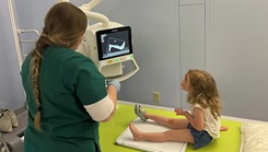 X-ray Technician student Olivia Tucker at Bassett Army Community Hospital located in Fort Wainwright, Alaska, takes extra time to explain each step of 3-year-old Hazel’s cast removal