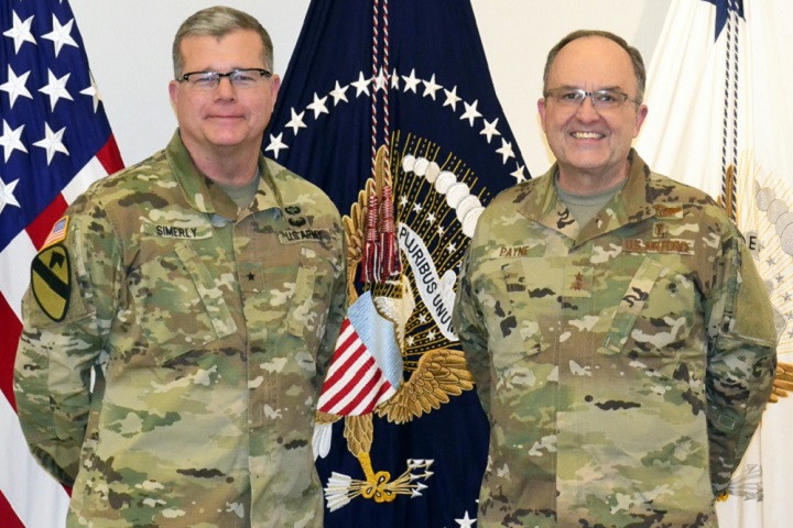 Army Brig. Gen. Mark Simerly , DLA Troop Support commander, left, poses with Air Force Maj. Gen. Lee Payne, DHAâ€™s Combat Support Agency assistant director, right, during a visit Jan. 11, 2019 in Philadelphia. DLA Troop Support hosted Payne to discuss current support operations and plans as DHA assumes management and administration of military treatment facilities. (DoD photo by Shaun Eagan)
