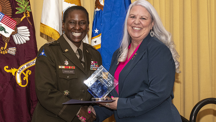 Image of U.S. Army Lt. Gen. Telita Crosland, director of the Defense Health Agency, presents Beverly Luce, senior nurse consultant with DHA’s Primary Care Clinical Management Team, the Federal Military Nursing Leadership Excellence Award. Luce was given the award during the Military Health System awards ceremony at National Harbor, Maryland, on Feb. 16.   .