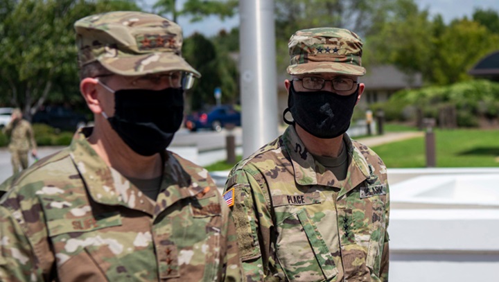 Image of Two soldiers in masks, talking.
