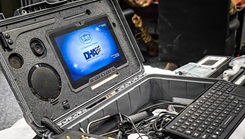 Heavy duty laptop with the 'DHA' background