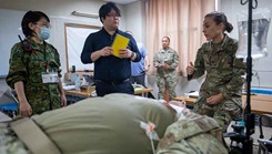 U.S. Army Capt. Hailey Benesch, an emergency physician assigned to headquarters Battalion I Corps, speaks with Japanese Capt. Miki Masuda, a health affairs officer assigned to the surgeon office, Eastern Army Headquarters, during a trilateral medical training event as part of Yama Sakura 87 held at Camp Asaka, Japan, Dec. 3, 2024. The training is an example of the commitment to lifesaving care and medical documentation in a complex, contested environment required to save lives. (Photo by U.S. Army Spc. Samarion Hicks)