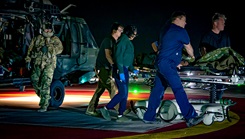 Medical staff move a simulated patient to the emergency department after an Arizona Army National Guard UH-60 Black Hawk MedEvac landing at HonorHealth Scottsdale Osborn Medical Center in Scottsdale, Arizona, Nov. 14, 2024. Civilian and military medical personnel from HonorHealth participated in Exercise Desert Hammer 25-1, receiving simulated patients from military personnel, bridging gaps in terminology and protocols. (Photo by U.S. Air Force Tech. Sgt. Tyler J. Bolken)