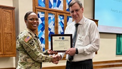 Munson Army Health Center Director, Col. Jolanda L.J. Walker, presented familiy medicine physician, Dr. Michael Dlugopolski, from the Department of Primary Care, with a certificate of retirement Jan. 14