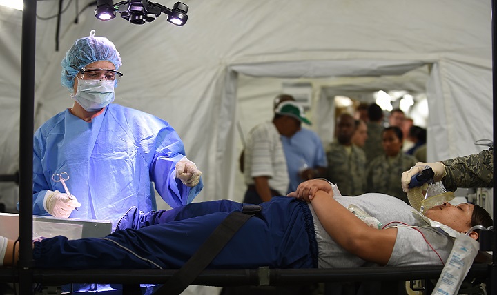 U.S. Air Force Emergency room doctors and technicians treat patients with simulated injuries and illnesses during a medical global response force training exercise at Joint Base Langley-Eustis, Virginia. Members of the medical group put the 25-bed field hospital to the test while treating real-world and simulated patients. (U.S. Air Force photo by Staff Sgt. Natasha Stannard)