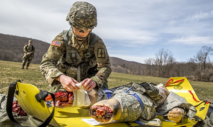 U.S. Army Spc. Courtney Natal provides aid to a simulated casualty. Born out of necessity on the battlefield, a new medical device is buying vital time for critically wounded patients in combat and in emergency care environments worldwide. (U.S. Army photo by Sgt. Harley Jelis)