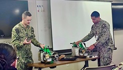 military medical personnel deliver pesticide equipment