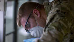 Military personnel wearing a face masks