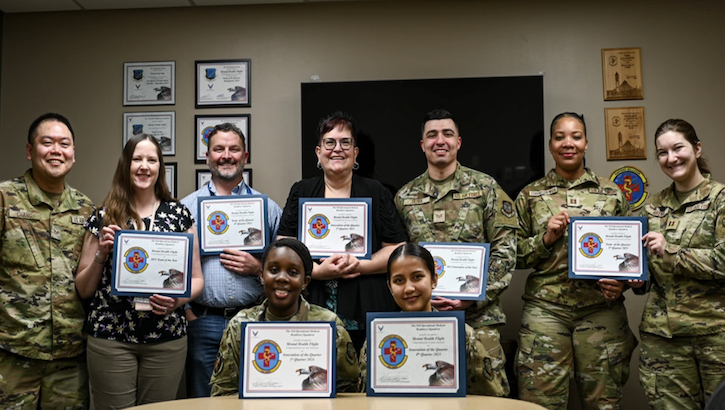 Members of the 92nd Operational Medical Readiness Squadron pose with awards