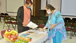 Luewana Hannon (left), community ready and resilient integrator, provides information to Georgia Louis (right) during the education and information fair at the Join Readiness Training Center and Fort Polk Army Community Service, Sept. 20.